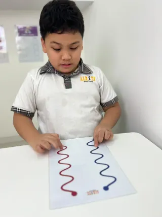 Student working on neuro stimulation therapy exercises